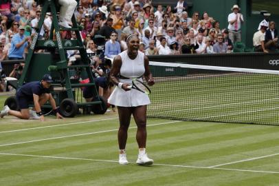 US player Serena Williams celebrates beating US player Alison Riske during their womens singles quarter-final match on day eight of the 2019 Wimbledon Championships at The All England Lawn Tennis Club in Wimbledon, southwest London, on July 9, 2019. (Photo by Adrian DENNIS / AFP) / RESTRICTED TO EDITORIAL USE