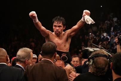 Manny Pacquiao v Adrien BronerLAS VEGAS, NEVADA - JANUARY 19: Manny Pacquiao celebrates after defeating Adrien Broner by unanimous decision during the WBA welterweight championship at MGM Grand Garden Arena on January 19, 2019 in Las Vegas, Nevada.   Christian Petersen/Getty Images/AFPEditoria: SPOLocal: Las VegasIndexador: Christian PetersenSecao: BoxingFonte: GETTY IMAGES NORTH AMERICAFotógrafo: STF