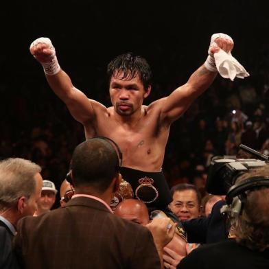 Manny Pacquiao v Adrien BronerLAS VEGAS, NEVADA - JANUARY 19: Manny Pacquiao celebrates after defeating Adrien Broner by unanimous decision during the WBA welterweight championship at MGM Grand Garden Arena on January 19, 2019 in Las Vegas, Nevada.   Christian Petersen/Getty Images/AFPEditoria: SPOLocal: Las VegasIndexador: Christian PetersenSecao: BoxingFonte: GETTY IMAGES NORTH AMERICAFotógrafo: STF