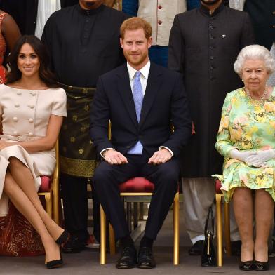 Meghan Markle, príncipe Harry e rainha Elizabeth II