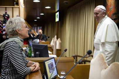 Data: 11/12/2018This handout photo taken on December 11, 2018 and released by the Vatican Media office on July 25, 2019, shows Pope Francis smiling to Brazilian Cristiane Murray (L) in the Synod hall at the Vatican. - Pope Francis named Cristiane Murray as deputy director of the Holy Sees Press Office to flank the newly director Matteo Bruni who has been appointed last week in his new assignment. (Photo by - / VATICAN MEDIA / AFP) / RESTRICTED TO EDITORIAL USE - MANDATORY CREDIT AFP PHOTO / VATICAN MEDIA - NO MARKETING NO ADVERTISING CAMPAIGNS - DISTRIBUTED AS A SERVICE TO CLIENTS