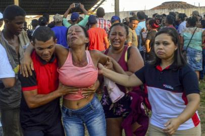  Relatives of inmates react after getting information about their loved ones a day after a riot at the Altamira Regional Recovery Centre in the Brazilian northern city of Altamira, Para State, on July 30, 2019. - Forty-six inmates involved in one of Brazils deadliest prison riots are being transferred to other jails on Tuesday, an official said. At least 57 people were killed on Monday when fighting broke out between rival drug gang factions in the Altamira Regional Recovery Centre in the northern state of Para. (Photo by Bruno SANTOS / AFP)Editoria: CLJLocal: AltamiraIndexador: BRUNO SANTOSSecao: prisonFonte: AFPFotógrafo: STR