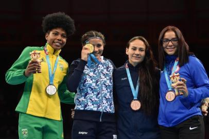  (L-R) Brazils Jucielen Cerqueira, Argentinas Leonela Sanchez, Colombias Yeni Arias and US Yarisel Ramirez pose on the podium with their silver, gold, bronze and bronze medals respectively after competing in the Womens Bantam (54-57kg) Finals of the Boxing competition of the Lima 2019 Pan-American Games at the Miguel Grau Coliseum in Callao on August 1, 2019. (Photo by Cris BOURONCLE / AFP)Editoria: SPOLocal: CallaoIndexador: CRIS BOURONCLESecao: boxingFonte: AFPFotógrafo: STF