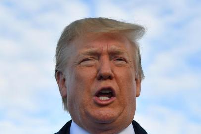 (FILES) In this file photo taken on June 5, 2019 US President Donald Trump speaks before boarding Air Force One at Shannon Airport in Shannon, Ireland, and fly to Normandy, France, to attend the 75th D-Day Anniversary. - US President Donald Trump said late on June 7, 2019 that Washington had reached an agreement with Mexico on migration, and that the punishing tariffs he had been threatening were indefinitely suspended. (Photo by MANDEL NGAN / AFP)