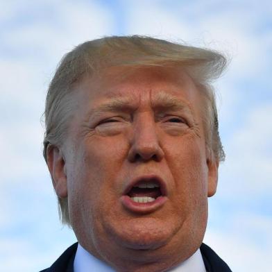 (FILES) In this file photo taken on June 5, 2019 US President Donald Trump speaks before boarding Air Force One at Shannon Airport in Shannon, Ireland, and fly to Normandy, France, to attend the 75th D-Day Anniversary. - US President Donald Trump said late on June 7, 2019 that Washington had reached an agreement with Mexico on migration, and that the punishing tariffs he had been threatening were indefinitely suspended. (Photo by MANDEL NGAN / AFP)