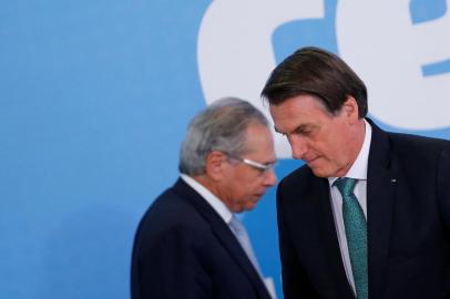 Brazils President Jair Bolsonaro reacts near Brazils Economy Minister Paulo Guedes during the ceremony to launch the new worker fund stimulus at the Planalto Palace in BrasiliaBrazils President Jair Bolsonaro reacts near Brazils Economy Minister Paulo Guedes during the ceremony to launch the new worker fund stimulus at the Planalto Palace in Brasilia, Brazil July 24, 2019. REUTERS/Adriano Machado ORG XMIT: GGGAHM01Local: BRASILIA ;BRAZIL