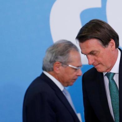 Brazils President Jair Bolsonaro reacts near Brazils Economy Minister Paulo Guedes during the ceremony to launch the new worker fund stimulus at the Planalto Palace in BrasiliaBrazils President Jair Bolsonaro reacts near Brazils Economy Minister Paulo Guedes during the ceremony to launch the new worker fund stimulus at the Planalto Palace in Brasilia, Brazil July 24, 2019. REUTERS/Adriano Machado ORG XMIT: GGGAHM01Local: BRASILIA ;BRAZIL