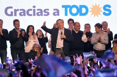  In this handout photo released by  TELAM  presidential hopeful Alberto Fernandez speaks to supporters after learning the first results of the primary elections in Buenos Aires on August 11, 2019. - President Mauricio Macri suffered a crushing defeat as Argentines voted in party primaries on Sunday ahead of Octobers general election. Center-left nominee Alberto Fernandez led by around 15 points after partial results were revealed as center-right, pro-business Macri admitted it had been a bad election. (Photo by Julian Alvarez / TELAM / AFP) / Argentina OUT / RESTRICTED TO EDITORIAL USE - MANDATORY CREDIT AFP PHOTO /  TELAM / Julian ALVAREZ - NO MARKETING - NO ADVERTISING CAMPAIGNS - DISTRIBUTED AS A SERVICE TO CLIENTSEditoria: POLLocal: Buenos AiresIndexador: JULIAN ALVAREZSecao: electionFonte: TELAMFotógrafo: STR