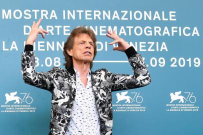 British musician, singer and actor Mick Jagger poses during a photocall for the film The Burnt Orange Heresy presented out of competition on September 7, 2019 during the 76th Venice Film Festival at Venice Lido. (Photo by Alberto PIZZOLI / AFP)