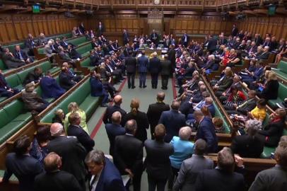 A video grab from footage broadcast by the UK Parliaments Parliamentary Recording Unit (PRU) shows the tellers lining up to deliver the results on a vote on a motion asking the government to publish its impact assessments for a no-deal Brexit in the House of Commons in London on September 9, 2019, - British MPs on Monday voted narrowly in favour of a motion asking the government to publish its impact assessments for a no-deal Brexit, in a new blow for Prime Minister Boris Johnson. The motion, which passed by 311 votes to 302, also asks the government to publish communications between government officials over their plans for the suspension of parliament. (Photo by HO / PRU / AFP) / RESTRICTED TO EDITORIAL USE - MANDATORY CREDIT  AFP PHOTO / PRU  - NO USE FOR ENTERTAINMENT, SATIRICAL, MARKETING OR ADVERTISING CAMPAIGNS - EDITORS NOTE THE IMAGE HAS BEEN DIGITALLY ALTERED AT SOURCE TO OBSCURE VISIBLE DOCUMENTS