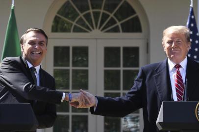 US President Donald Trump shakes hands with Brazil's President Jair Bolsonaro during a joint press conference in the Rose Garden at the White House on March 19, 2019 in Washington, DC. (Photo by Jim WATSON / AFP)