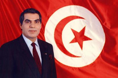 (FILES) In this file photo taken on April 01, 1988 former President Zine el-Abidine Ben Ali 1987 poses for an official picture in front of the Tunisian flag. - Tunisias all-powerful leader for two decades, Zine El Abidine Ben Ali was forced from power and into exile by a landmark popular uprising in early 2011, sparking revolts across the Arab world. The man who once appeared in official portraits with a benevolent smile and jet black hair died Thursday aged 83, in Saudi Arabia, Tunisias foreign ministry said. (Photo by Handout / AFP)