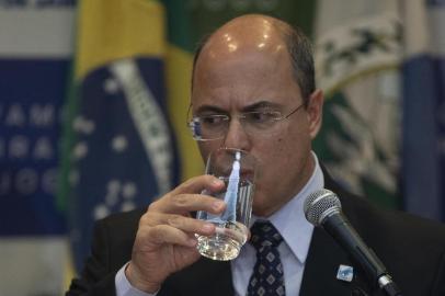 Rio de Janeiros Governor Wilson Witzel (L) delivers a press conference in Rio de Janeiro, Brazil, on September 23, 2019, after eight-year-old Agatha Sales Felix died during a police operation at the Alemao complex slum. - Felix was killed by a stray bullet during a confrontation between alleged drug traffickers and police officers on September 21. (Photo by MAURO PIMENTEL / AFP)