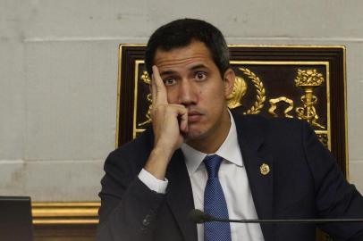 Venezuelan opposition leader and self-proclaimed acting president Juan Guaido gestures during a session of the National Assembly with the presence of pro-government deputies in Caracas on September 24, 2019. - US President Donald Trump on Tuesday warned the United States was watching the situation in Venezuela very closely, as it unleashed new sanctions targeting the crisis-wracked countrys ties with Cuba. (Photo by Matias Delacroix / AFP)