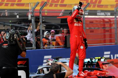 Ferrari's Monegasque driver Charles Leclerc celebrates after taking pole position after the qualifying session for the Formula One Russian Grand Prix at The Sochi Autodrom Circuit in Sochi on September 28, 2019. Dimitar DILKOFF / AFP