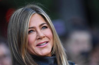 (FILES) In this file photo taken on June 10, 2019 US actress Jennifer Aniston arrives to attend the Los Angeles premiere screening of the Netflix film "Murder Mystery" at the Regency Village Theatre in Los Angeles. - When Jennifer Aniston signed up to help launch Apple's new streaming TV service with a star-studded drama set in the colorful, cutthroat world of morning news, it seemed straightforward enough. Then #MeToo happened. Aniston, preparing for her first return to television since "Friends," watched along with the rest of America in 2017 as anchors from NBC's Matt Lauer to CBS's Charlie Rose lost their jobs after being accused by women of sexual misconduct. "Once #MeToo happened, obviously the conversation has drastically changed -- and then we just incorporated it," said Aniston, who stars in "The Morning Show" along with Reese Witherspoon. (Photo by VALERIE MACON / AFP)