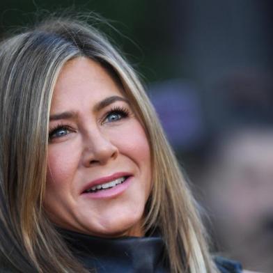 (FILES) In this file photo taken on June 10, 2019 US actress Jennifer Aniston arrives to attend the Los Angeles premiere screening of the Netflix film "Murder Mystery" at the Regency Village Theatre in Los Angeles. - When Jennifer Aniston signed up to help launch Apple's new streaming TV service with a star-studded drama set in the colorful, cutthroat world of morning news, it seemed straightforward enough. Then #MeToo happened. Aniston, preparing for her first return to television since "Friends," watched along with the rest of America in 2017 as anchors from NBC's Matt Lauer to CBS's Charlie Rose lost their jobs after being accused by women of sexual misconduct. "Once #MeToo happened, obviously the conversation has drastically changed -- and then we just incorporated it," said Aniston, who stars in "The Morning Show" along with Reese Witherspoon. (Photo by VALERIE MACON / AFP)