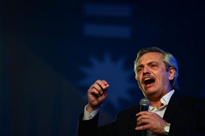 Argentinas presidential candidate for the Frente de Todos party Alberto Fernandez addresses supporters after being elected as new president, at the headquarters of the party in Buenos Aires after polls closed in Argentinas general election on October 27, 2019. - Peronist candidate Alberto Fernandez won Argentinas presidential election in the first round on Sunday, official results showed, bringing to an end the crisis-plagued rule of market-friendly incumbent Mauricio Macri. (Photo by RONALDO SCHEMIDT / AFP)