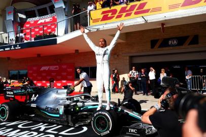 AUSTIN, TEXAS - NOVEMBER 03: 2019 Formula One World Drivers Champion Lewis Hamilton of Great Britain and Mercedes GP celebrates in parc ferme during the F1 Grand Prix of USA at Circuit of The Americas on November 03, 2019 in Austin, Texas.   Dan Istitene/Getty Images/AFP