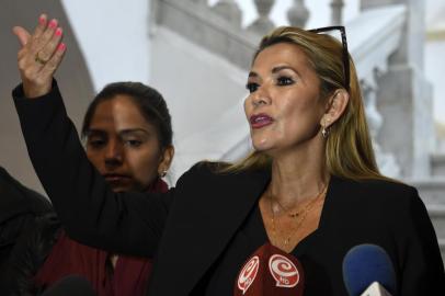 Bolivia's deputy senate speaker, Jeanine Anez, delivers a press conference at the Congress building in La Paz, on November 12, 2019. - Bolivia's Evo Morales was en route to exile in Mexico on Tuesday, leaving behind a country in turmoil after his abrupt resignation as president. The senator set to succeed Morales as interim president, Jeanine Anez, pledged to call fresh elections to end the political crisis. (Photo by AIZAR RALDES / AFP)