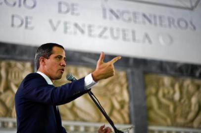 Venezuelan opposition leader and self-proclaimed acting president Juan Guaido speaks during a meeting with union leaders, in Caracas on November 11, 2019. - Guaido said Monday the resignation of Bolivian President Evo Morales was a hurricane of democracy and renewed his call for protests against Venezuelan President Nicolas Maduro. (Photo by Federico PARRA / AFP)