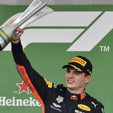 Red Bulls Dutch driver Max Verstappen celebrates at the podium after winning the F1 Brazil Grand Prix, at the Interlagos racetrack in Sao Paulo, Brazil on November 17, 2019. (Photo by NELSON ALMEIDA / AFP)