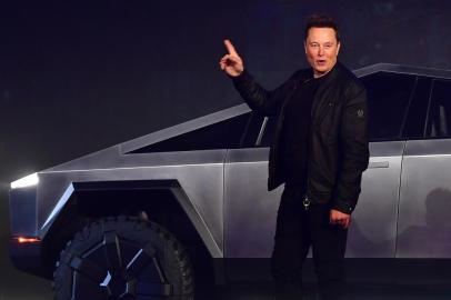 Tesla co-founder and CEO Elon Musk gestures while introducing the newly unveiled all-electric battery-powered Tesla Cybertruck at Tesla Design Center in Hawthorne, California on November 21, 2019. (Photo by Frederic J. BROWN / AFP)