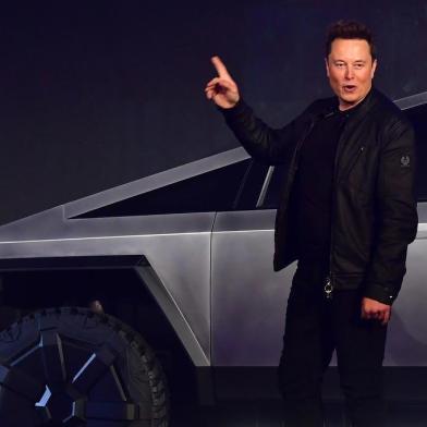 Tesla co-founder and CEO Elon Musk gestures while introducing the newly unveiled all-electric battery-powered Tesla Cybertruck at Tesla Design Center in Hawthorne, California on November 21, 2019. (Photo by Frederic J. BROWN / AFP)