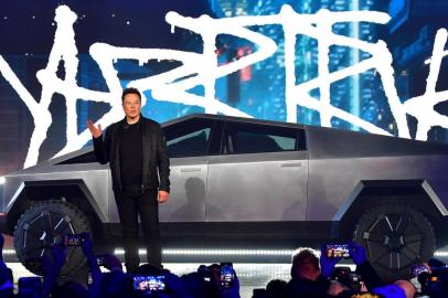 Tesla co-founder and CEO Elon Musk introduces the newly unveiled all-electric battery-powered Tesla Cybertruck at Tesla Design Center in Hawthorne, California on November 21, 2019. (Photo by Frederic J. BROWN / AFP)