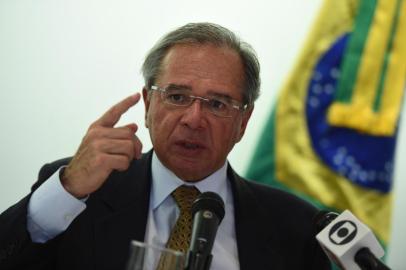 Brazils Minister of Economy, Paulo Guedes, speaks during a press conference at the Embassy of Brazil in Washington, DC on November 25, 2019. (Photo by Olivier DOULIERY / AFP)