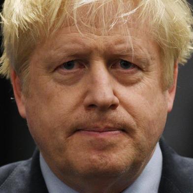 Britains Prime Minister and Conservative leader Boris Johnson gives a speech on stage after retaining his seat to be MP for Uxbridge and Ruislip South at the count centre in Uxbridge, west London, on December 13, 2019 after votes were counted as part of the UK general election. (Photo by Oli SCARFF / AFP)