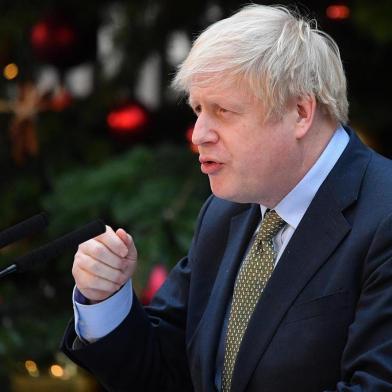 Britains Prime Minister Boris Johnson delivers a speech outside 10 Downing Street in central London on December 13, 2019, following his Conservative partys general election victory. - UK Prime Minister Boris Johnson proclaimed a political earthquake Friday after his thumping election victory cleared Britains way to finally leave the European Union after years of damaging deadlock over Brexit. (Photo by DANIEL LEAL-OLIVAS / AFP)<!-- NICAID(14358629) -->