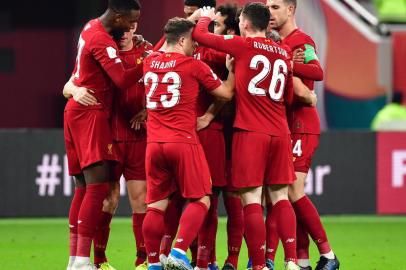 Liverpools players celebrate their opening goal during the 2019 FIFA Club World Cup semi-final football match between Mexicos Monterrey and Englands Liverpool at the Khalifa International Stadium in the Qatari capital Doha on December 18, 2019. (Photo by Giuseppe CACACE / AFP)