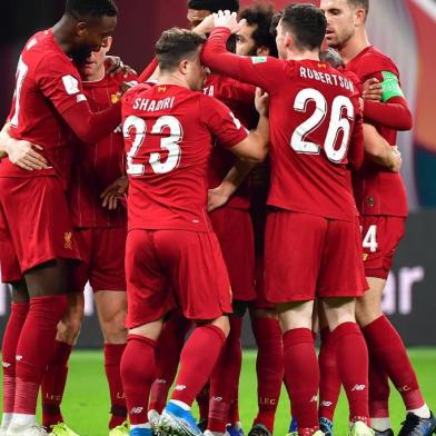 Liverpools players celebrate their opening goal during the 2019 FIFA Club World Cup semi-final football match between Mexicos Monterrey and Englands Liverpool at the Khalifa International Stadium in the Qatari capital Doha on December 18, 2019. (Photo by Giuseppe CACACE / AFP)