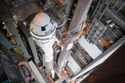 In this image released by NASA, a United Launch Alliance Atlas V rocket with Boeings CST-100 Starliner spacecraft onboard is prepared to roll out of the Vertical Integration Facility on December 18, 2019, to the launch pad at Space Launch Complex 41 ahead of the December 20, Orbital Flight Test at Cape Canaveral Air Force Station in Florida. - Boeing is all set to launch its Starliner spacecraft for the first time to the International Space Station at the end of this week, a key mission as NASA looks to resume crewed flight by 2020. This time around its sole passenger will be bandana-clad dummy Rosie, named after Rosie the Riveter, a campaign icon used to recruit women to munitions factory jobs during World War II. (Photo by Joel KOWSKY / NASA / AFP) / RESTRICTED TO EDITORIAL USE - MANDATORY CREDIT AFP PHOTO / NASA/Joel Kowsky - NO MARKETING - NO ADVERTISING CAMPAIGNS - DISTRIBUTED AS A SERVICE TO CLIENTS<!-- NICAID(14365532) -->