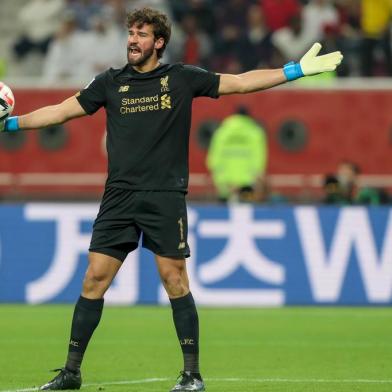 Liverpools Brazilian goalkeeper Alisson Becker speaks to his teammates during the 2019 FIFA Club World Cup Final football match between Englands Liverpool and Brazils Flamengo at the Khalifa International Stadium in the Qatari capital Doha on December 21, 2019. (Photo by KARIM JAAFAR / AFP)