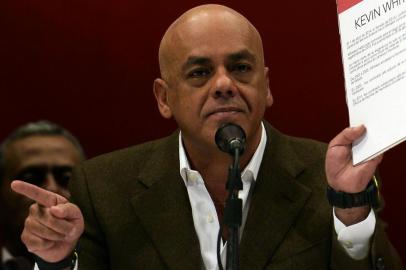 The mayor of the Libertador municipality Jorge Rodriguez (L) shows documents next to the President of National Emsembly Diosdado Cabello, during a press conference in Caracas on May 28, 2014. The leadership of Chavez Wednesday accused a handful of opposition politicians, including Congresswoman destitute Maria Corina Machado and the US ambassador in Colombia, Kevin Whitaker, of plotting a coup and assassination against the president Nicolas Maduro.  AFP   PHOTO/JUAN BARRETO