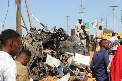 The wreckage of a car that was destroyed during the car bomb that exploded in Mogadishu that killed more than 20 people is photographed in Mogadishu on December 28, 2019. - A massive car bomb exploded in a busy area of the Somali capital Mogadishu on December 28, 2019, leaving more than 20 people dead. (Photo by Abdirazak Hussein FARAH / AFP)<!-- NICAID(14372588) -->