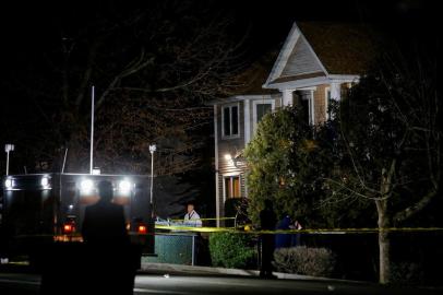 A police officer in white clothes exits the house where 5 people were stabbed at a Hasidic rabbis home in Monsey, New York, U.S. December 29, 2019.