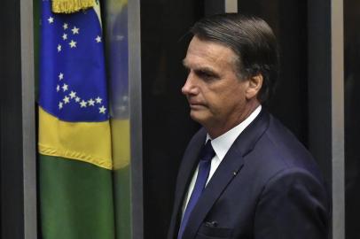  Brazils newly sworn-in President Jair Bolsonaro is pictured during his inauguration ceremony, at the Congress in Brasilia on January 1, 2019. - Bolsonaro takes office with promises to radically change the path taken by Latin Americas biggest country by trashing decades of centre-left policies. (Photo by NELSON ALMEIDA / AFP)Editoria: POLLocal: BrasíliaIndexador: NELSON ALMEIDASecao: governmentFonte: AFPFotógrafo: STF