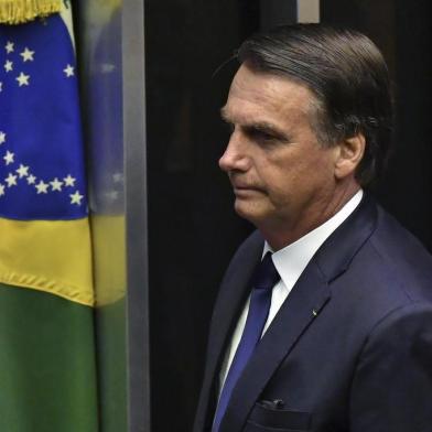  Brazils newly sworn-in President Jair Bolsonaro is pictured during his inauguration ceremony, at the Congress in Brasilia on January 1, 2019. - Bolsonaro takes office with promises to radically change the path taken by Latin Americas biggest country by trashing decades of centre-left policies. (Photo by NELSON ALMEIDA / AFP)Editoria: POLLocal: BrasíliaIndexador: NELSON ALMEIDASecao: governmentFonte: AFPFotógrafo: STF