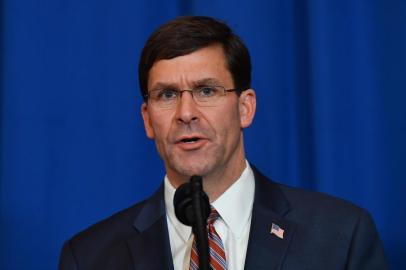 (FILES) In this file photo taken on December 29, 2019 US Secretary of Defense Mark Esper speaks onstage during a briefing on the past 72 hours events in Mar a Lago, Palm Beach, Florida on December 29, 2019. - US Defense Secretary Mark Esper denied on January 6, 2020 that US forces would pull out of Iraq, after a US generals letter told the Iraqi government that troops were preparing to depart in due deference to the sovereignty of the country. (Photo by Nicholas Kamm / AFP)<!-- NICAID(14378975) -->