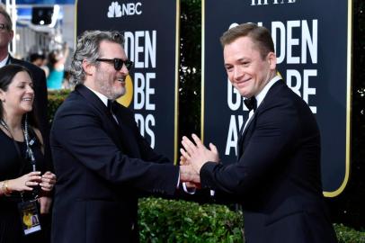 BEVERLY HILLS, CALIFORNIA - JANUARY 05:(L-R) Joaquin Phoenix and Taron Egerton attend the 77th Annual Golden Globe Awards at The Beverly Hilton Hotel on January 05, 2020 in Beverly Hills, California.   Frazer Harrison/Getty Images/AFP<!-- NICAID(14379129) -->