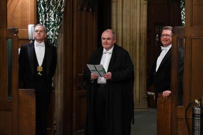 A handout photograph released by the UK Parliament shows the European Union (Withdrawal Agreement) Bill being carried between the two Houses of Parliament by the Clerk of Legislation Liam Lawrence Smyth (C ) in the House of Commons in central London on January 22, 2020. (Photo by JESSICA TAYLOR / various sources / AFP) / RESTRICTED TO EDITORIAL USE - NO USE FOR ENTERTAINMENT, SATIRICAL, ADVERTISING PURPOSES - MANDATORY CREDIT  AFP PHOTO / Jessica Taylor /UK Parliament<!-- NICAID(14395034) -->