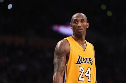 (FILES) In this November 20, 2015 file photo, Kobe Bryant (24) of the Los Angeles Lakers looks on during the Lakers NBA match up with the Toronto Raptors at the Staples Center in Los Angeles, California.  Kobe Bryant says he still loves competition, but admits that his body can no longer handle the rigors of professional basketball as he announced November 29, 2015 that this will be his final NBA season. The 37-year-old five-time champion will retire as one of the greatest clutch players in history, and after spending his entire 20-year career with the Los Angeles Lakers.  AFP PHOTO/ ROBYN BECK / AFP / ROBYN BECK<!-- NICAID(11857008) -->