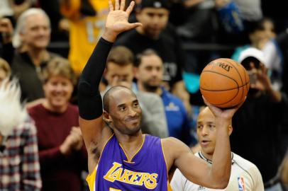 MINNEAPOLIS, MN - DECEMBER 14: Kobe Bryant #24 of the Los Angeles Lakers waves to the crowd after passing Michael Jordan on the all-time scoring list with a free throw in the second quarter of the game on December 14, 2014 at Target Center in Minneapolis, Minnesota. NOTE TO USER: User expressly acknowledges and agrees that, by downloading and or using this Photograph, user is consenting to the terms and conditions of the Getty Images License Agreement.   Hannah Foslien/Getty Images/AFP<!-- NICAID(11060888) -->