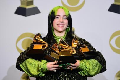 US singer-songwriter Billie Eilish poses in the press room with the awards for Album Of The Year, Record Of The Year, Best New Artist, Song Of The Year and Best Pop Vocal Album during the 62nd Annual Grammy Awards on January 26, 2020, in Los Angeles. (Photo by FREDERIC J. BROWN / AFP)