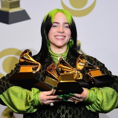 US singer-songwriter Billie Eilish poses in the press room with the awards for Album Of The Year, Record Of The Year, Best New Artist, Song Of The Year and Best Pop Vocal Album during the 62nd Annual Grammy Awards on January 26, 2020, in Los Angeles. (Photo by FREDERIC J. BROWN / AFP)