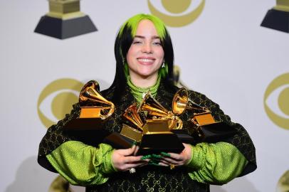 US singer-songwriter Billie Eilish poses in the press room with the awards for Album Of The Year, Record Of The Year, Best New Artist, Song Of The Year and Best Pop Vocal Album during the 62nd Annual Grammy Awards on January 26, 2020, in Los Angeles. (Photo by FREDERIC J. BROWN / AFP)<!-- NICAID(14399319) -->