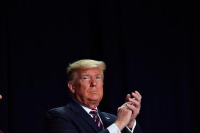 US President Donald Trump speaks at the 68th annual National Prayer Breakfast on February 6, 2020 in Washington,DC. - President Donald Trump said Thursday that he suffered a "terrible ordeal" during his impeachment. In his first public comments since being acquitted by the Senate of abuse of office, he said he had been "put through a terrible ordeal by some very dishonest and corrupt people." "They have done everything possible to destroy us and by so doing very badly hurt our nation," he said at a televised prayer breakfast with a Who's Who of Washington power brokers. (Photo by Nicholas Kamm / AFP)<!-- NICAID(14410906) -->